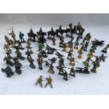 A collection of loose Diecast and plastic WWl and WWll soldiers , including Britains, Del prado etc