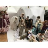 A collection of boxed Porcelain dolls, including Lady Diana, Mother and Child,Native American Red