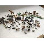 A collection of loose plastic Farm and Wild animal