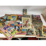 A box containing various comics including Eagle, W
