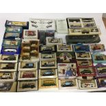 A collection of boxed die cast vehicles including