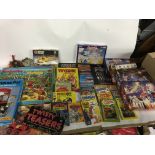 A box containing games, books and jigsaws, includi