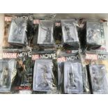 A box containing Marvel Movie collection figurines and magazines x8