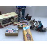 A collection of boxed toys including reproduction tinplate Japanese, a boxed Space shuttle and a