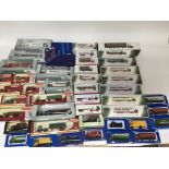 A collection of boxed die cast vehicles including