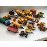 A collection of loose Diecast vehicles including Britains farm machinery, Skip lorry, Cement