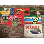 A collection of boxed board games including Cludo, Risk, Camelot, Careers , etc