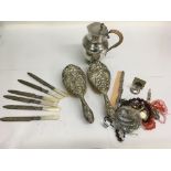 A silver brush set and odds