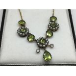 A necklace set with peridot, seed pearls and diamonds, boxed