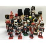 A collection of wooden nutcrackers in the form of toy soldiers.