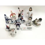 A group of various porcelain ornaments including Lomonosov Inuit figures.Minor chip to one rooster
