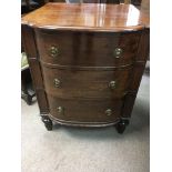 A mahogany side cabinet with lift up lid fitted with two drawers on fluted legs