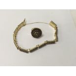 A 18 ct gold bracelet and chain inset with garnets