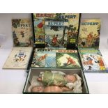 A collection of Rupert the bear annuals and two vintage dolls - NO RESERVE