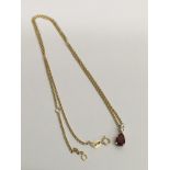An 18ct gold ruby and diamond set pendant necklace
