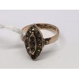 A 9ct gold oval shaped ring set with sapphires. Ap