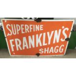 An enamel sign advertising 'Superfine Franklin's Shagg' Tobacco.Approx 54x77cm