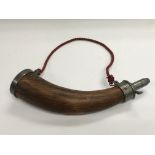 A wooden powder horn.
