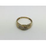 A 14k gold ring set with diamond chips, approx 2.6g and approx size R-S.