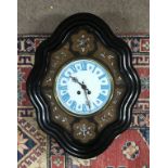 A French mother of pearl inlaid wall clock with ebonized frame.