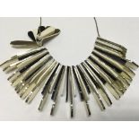 An early Deco style plastic necklace on silver chain