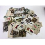 A small group of early 20th century postcards and cigarette silks - NO RESERVE