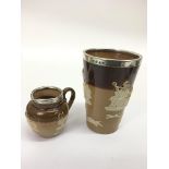 A Doulton Lambeth, silver rimmed, relief decorated beaker and jug