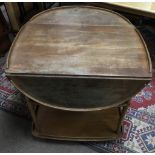 An Ercol light wood, drop leaf tea trolley. Extended approx 93x78cm high, worn