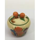 A Clarice Cliff, small 'Crocus' pattern preserve pot, the lid formed as cherries.Approx 9cm,