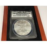 An American 25th Anniversary Silver (99.9) Eagle Dollar. First Day Issue. ANACS MS70 grade.