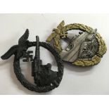 A pair of German WW2 badges to include a flak badge and E boat badge