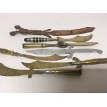 A collection of I World war trench art paper knifes some with bullet handles with regimental