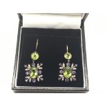 A pair of drop earrings set with peridot, amethyst and diamond, boxed