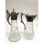 Two Edwardian, engraved glass claret jugs with silver plated mounts