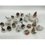 A group of various ceramic bird ornaments includin