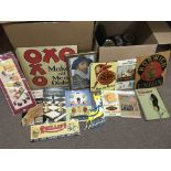 A collection of reproduction advertising signs and some vintage tins.