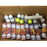 A box of golf balls and tees.