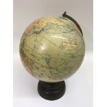 A 'Geographia' terrestrial globe on Bakelite base.