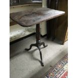 A Georgian mahogany occasion table the square top above a turned stem on splayed legs and a oak