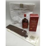 A boxed 70cl bottle of House Of Lords single malt whisky, associated tie, tie pin and carrier bag.