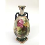 A Royal Worcester vase painted with roses.Approx 2