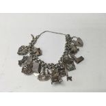 A silver charm bracelet and charms.