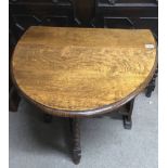 A drop leaf, oak occasional table.