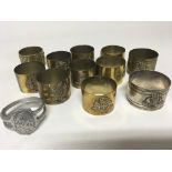 A collection of brass Trench Art shell cases with applied crests.