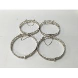 A group of four 925 silver bangles.