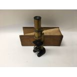 A small brass and cast iron microscope