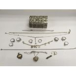 A collection of silver and white metal jewellery i
