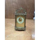 A brass cased 4 glass carriage clock