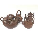 A collection of five Chinese terracotta late Republic tea pots in the form of fish and other