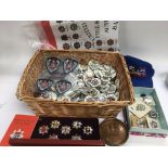 A collection of fire service items comprising various reproduction badges, n historical badges set